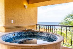 a large plunge pool in a room with a balcony at Grand Fiesta Americana Los Cabos All Inclusive Golf & Spa in Cabo San Lucas