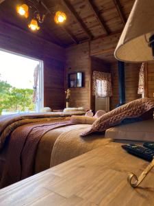 Ένα ή περισσότερα κρεβάτια σε δωμάτιο στο Estalagem Villa Serrana