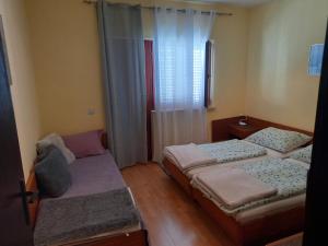 Postel nebo postele na pokoji v ubytování Apartman Goran
