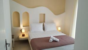 Кровать или кровати в номере Aelia Mare Apartments Nr3