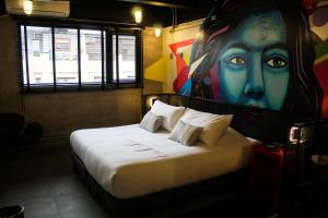 מיטה או מיטות בחדר ב-Hotel Sommelier LOFT