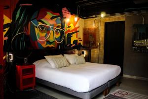 Postel nebo postele na pokoji v ubytování LOFT Hotel by Sommelier Hoteles