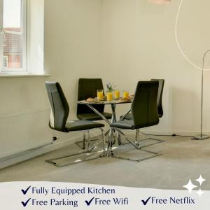 a dining room with a table and four chairs at K Suites - Teeswater - FREE PARKING in Bridgwater