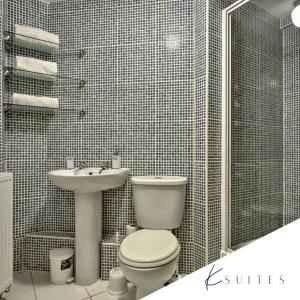 a bathroom with a toilet and a sink at K Suites - Friarn Lawn - FREE PARKING in Bridgwater