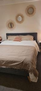 מיטה או מיטות בחדר ב-Casa Ludese