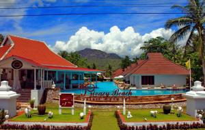 a resort with a swimming pool and a house at The Privacy Beach Resort & Spa in Sam Roi Yot