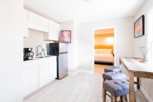 a kitchen and dining room with a table and chairs at 300 Tenth in Myrtle Beach