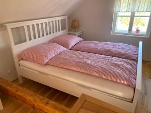A bed or beds in a room at Nad Slováckým sklípkem