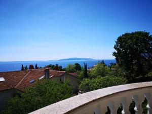 a view of the ocean from the balcony of a house at Villa Kopic in Opatija