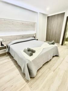 A bed or beds in a room at ISLAND SUITES