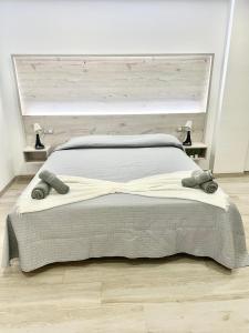 A bed or beds in a room at ISLAND SUITES