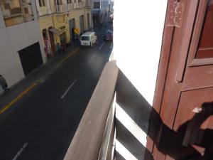 a view of a city street with a white van at Luxor in Arequipa