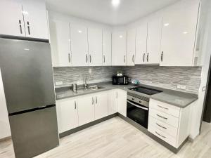 A kitchen or kitchenette at ISLAND SUITES