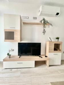 A television and/or entertainment centre at ISLAND SUITES