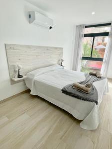 A bed or beds in a room at ISLAND SUITES