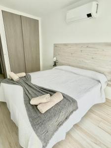 A bed or beds in a room at ISLAND SUITES