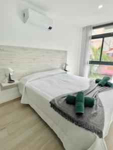 A bed or beds in a room at ISLAND SUITES Még 37 kép