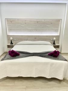 A bed or beds in a room at ISLAND SUITES