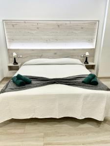 A bed or beds in a room at ISLAND SUITES