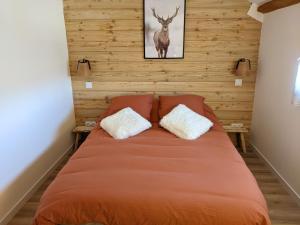 Ένα ή περισσότερα κρεβάτια σε δωμάτιο στο Appartemment type chalet