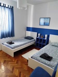 Postel nebo postele na pokoji v ubytování LuMar Holidays and Apartments