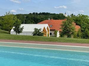 a rendering of a house and a road with a building at Domačija Pri Momi in Križevci