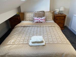 מיטה או מיטות בחדר ב-Grace's Home