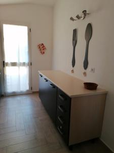 Kuchyň nebo kuchyňský kout v ubytování La Casa di su