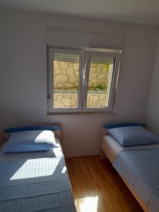 Posteľ alebo postele v izbe v ubytovaní Kike apartment + 17 fotografií
