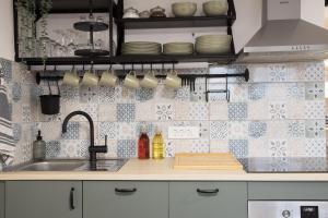 a kitchen with a sink and a counter top at Apartma Licko in Domžale