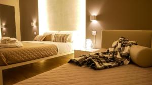 Postel nebo postele na pokoji v ubytování La Banchina Holiday Rooms