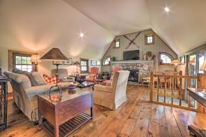 a living room filled with furniture and a fireplace at Family-Friendly Farmhouse - Near Lake and Ski Areas! in Harbor Springs
