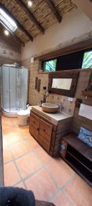 a bathroom with a sink and a toilet at Hacienda Mawaka in Ráquira