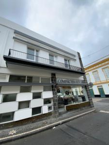a building on the side of a street at Luxury Loft Apartment in Ribeira Grande