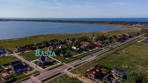 an aerial view of a small town next to the water at Pensjonat Basia in Dziwnówek