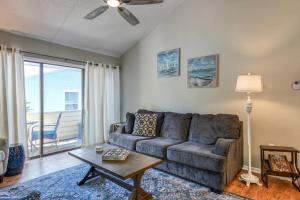 a living room with a couch and a table at Sea Turtle Shores in St. Augustine +32 photos