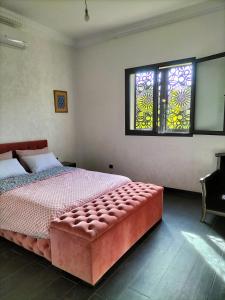 Een bed of bedden in een kamer bij Villa Nathalie Marrakech