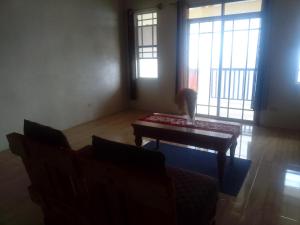 a cat sitting on a coffee table in a living room at Abigail's Spectacular 2 bedrooms-Entire Apartment in Tortola Island