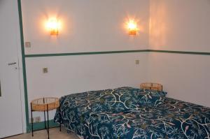 מיטה או מיטות בחדר ב-AU BORD DE L'EAU appartement 50 M2