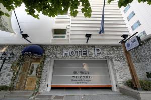 a store front of a hotel with a sign above it at Daegu February Hotel DongdaeguStation in Daegu