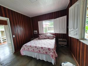 Säng eller sängar i ett rum på Casa Apuaú
