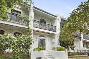 a white house with a balcony at WIND85P - Pet Friendly Paddo Terrace in Sydney