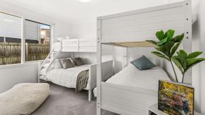 a bedroom with two bunk beds and a tv at Finding Remo in San Remo