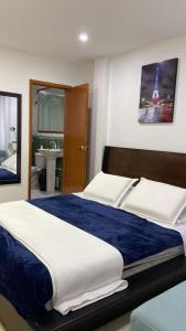 Säng eller sängar i ett rum på C HOTELERA REY.ES