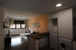 a kitchen and living room with a washer and dryer at Aguilas Residencial El Cedro BIF2 in Águilas