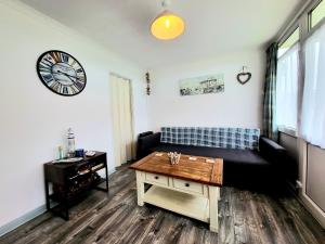 a living room with a couch and a table at Holiday Chalet no289 in Withernsea