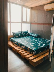 Postel nebo postele na pokoji v ubytování HNK's Homestay Quy Nhơn