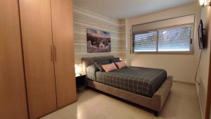 A bed or beds in a room at Alquiler Vacacional Salou W&S