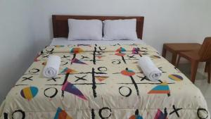 Filomena Lodge tesisinde bir odada yatak veya yataklar