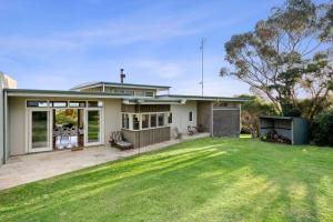 a house with a large yard in front of it at Kyarra in Aireys Inlet